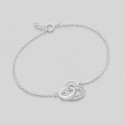 Srebrna zapestnica z obročkom in srčkom s cirkoniji