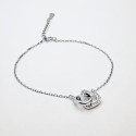 Srebrna zapestnica z obročkom in srčkom s cirkoniji